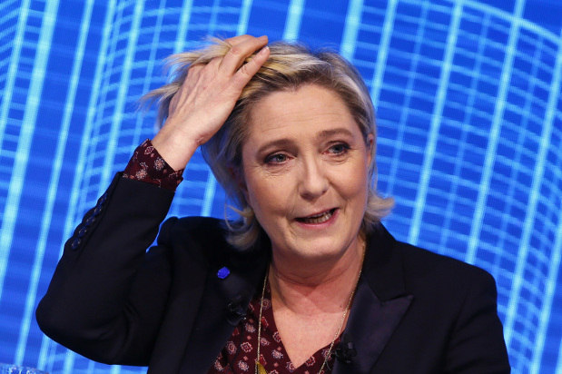 World News: France's Le Pen loses EU immunity over IS tweets